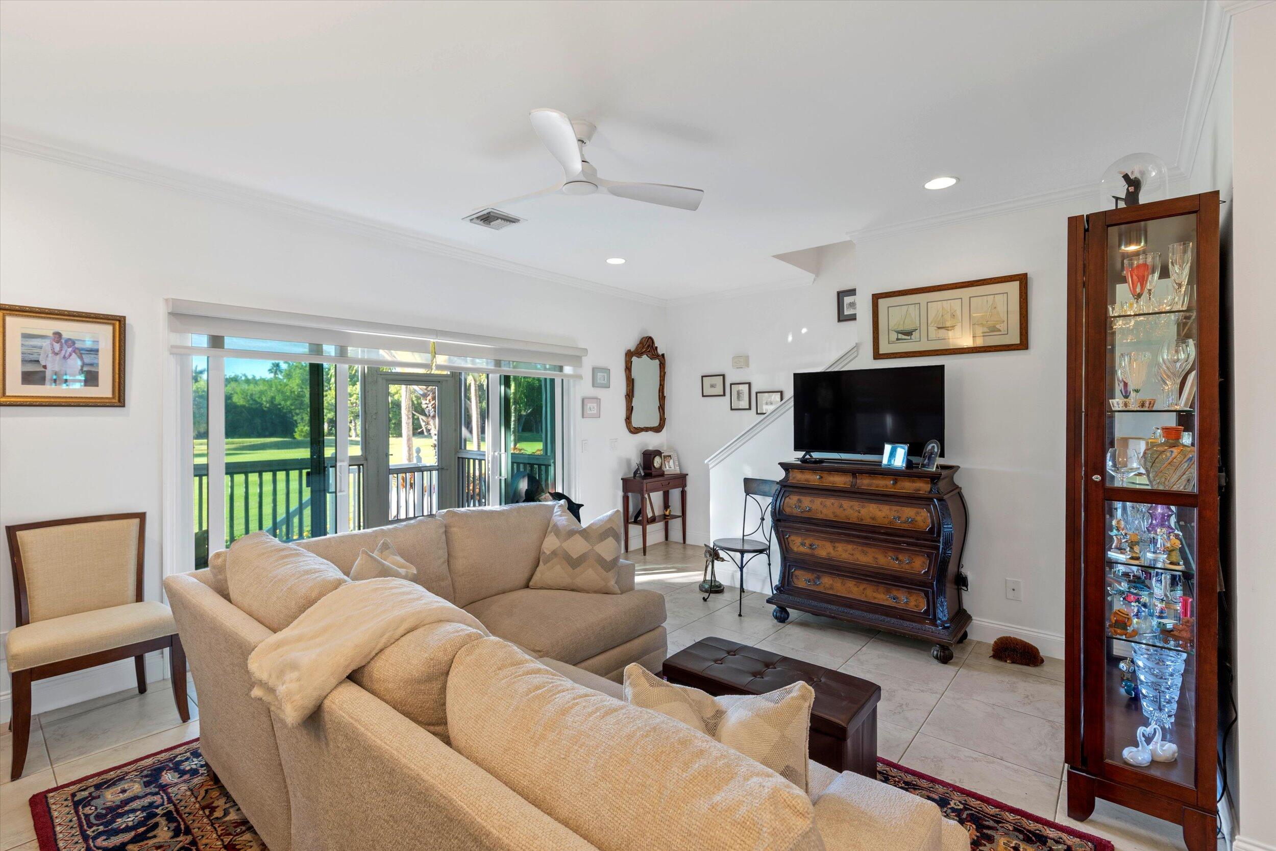 44 Spoonbill Way, Unit 1 Key West, FL 33040 - Photo 7 of 83 a living room with furniture and a flat screen tv