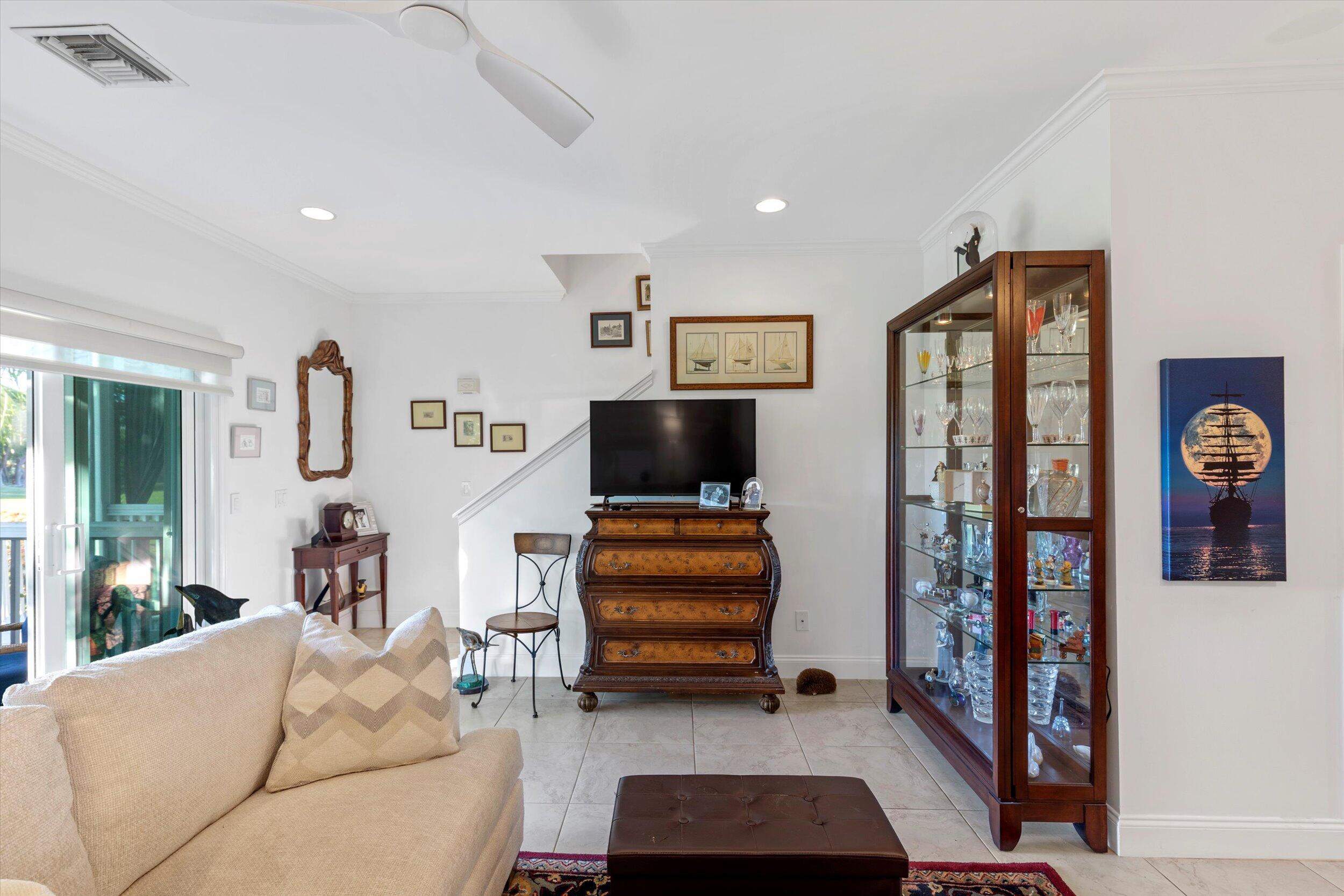 44 Spoonbill Way, Unit 1 Key West, FL 33040 - Photo 8 of 83 a living room with furniture and a flat screen tv