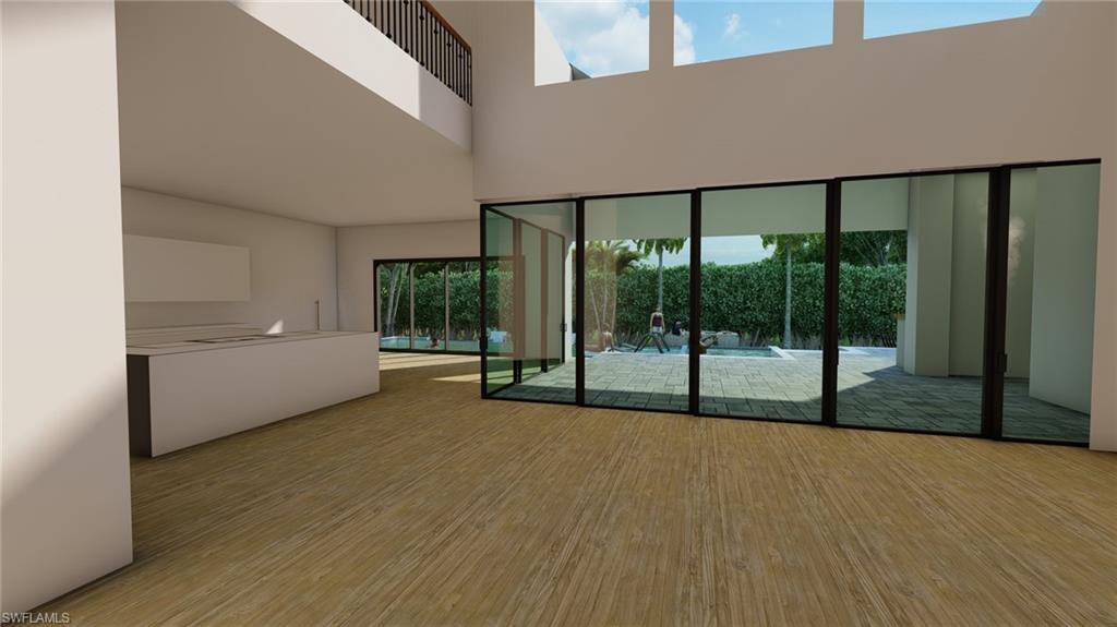 565 Whispering Pine Lane Naples, FL 34103 - Photo 12 of 12 a view of an empty room with glass door