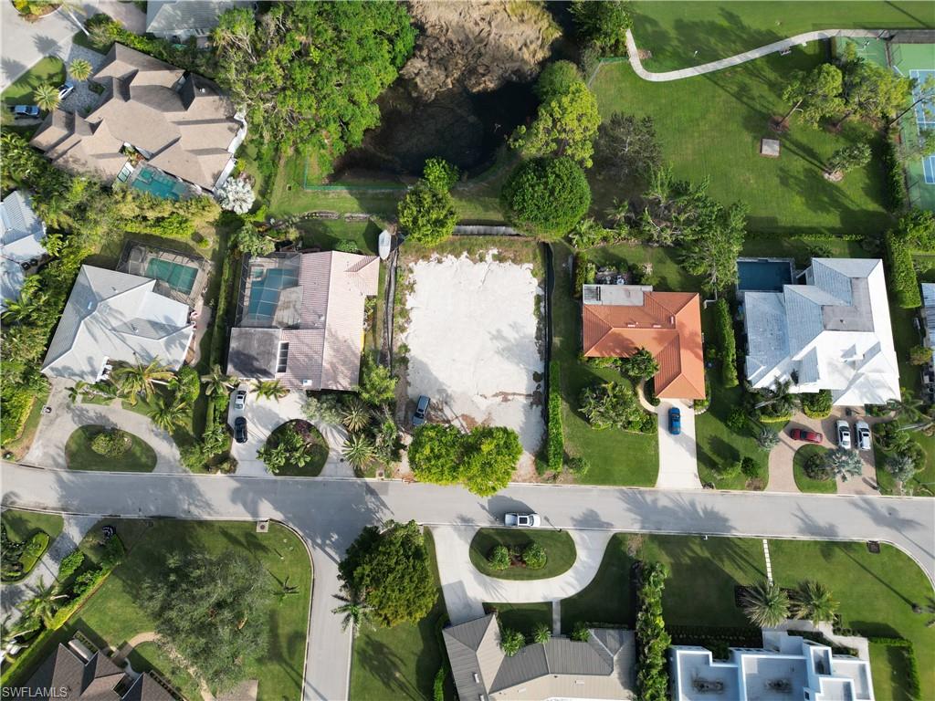 565 Whispering Pine Lane Naples, FL 34103 - Photo 2 of 12 an aerial view of a house with outdoor space