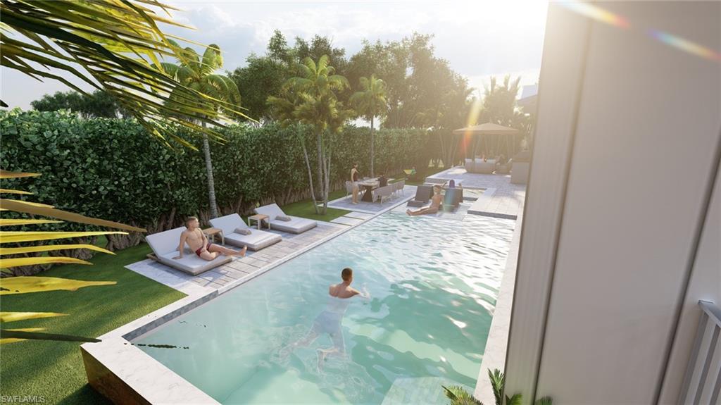 565 Whispering Pine Lane Naples, FL 34103 - Photo 10 of 12 a view of a swimming pool from a balcony