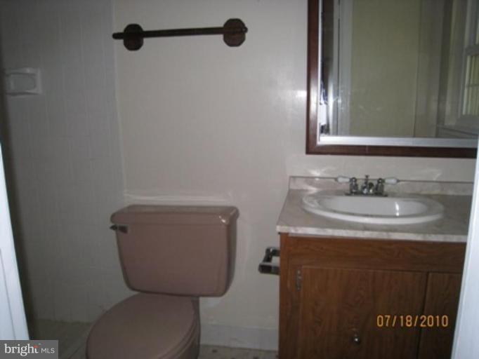 7404 Braddock Road Annandale, VA 22003 - Photo 8 of 15 a bathroom with a sink toilet and mirror