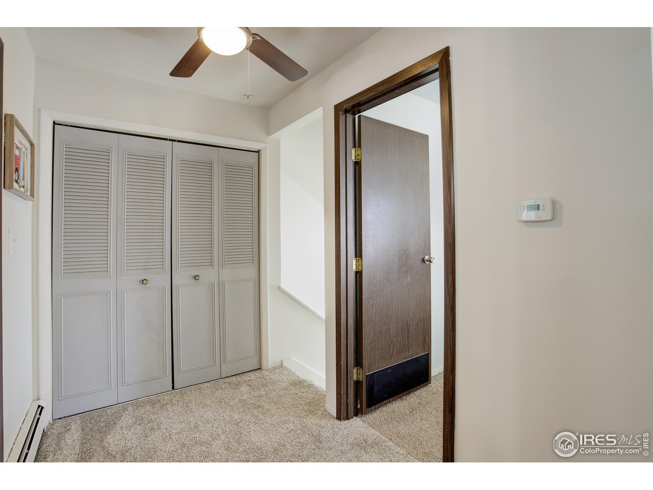 809 East Drake Road, Unit 104 Fort Collins, CO 80525 - Photo 22 of 36 Upper Floor Hallway with Ceiling Fan
