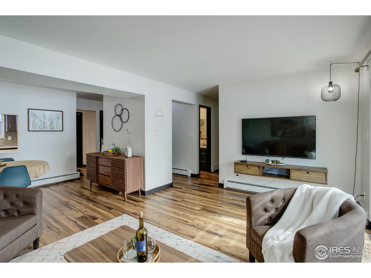809 East Drake Road, Unit 104 Fort Collins, CO 80525 - Photo 3 of 36 Living Room with Included Entertainment Unit Under TV