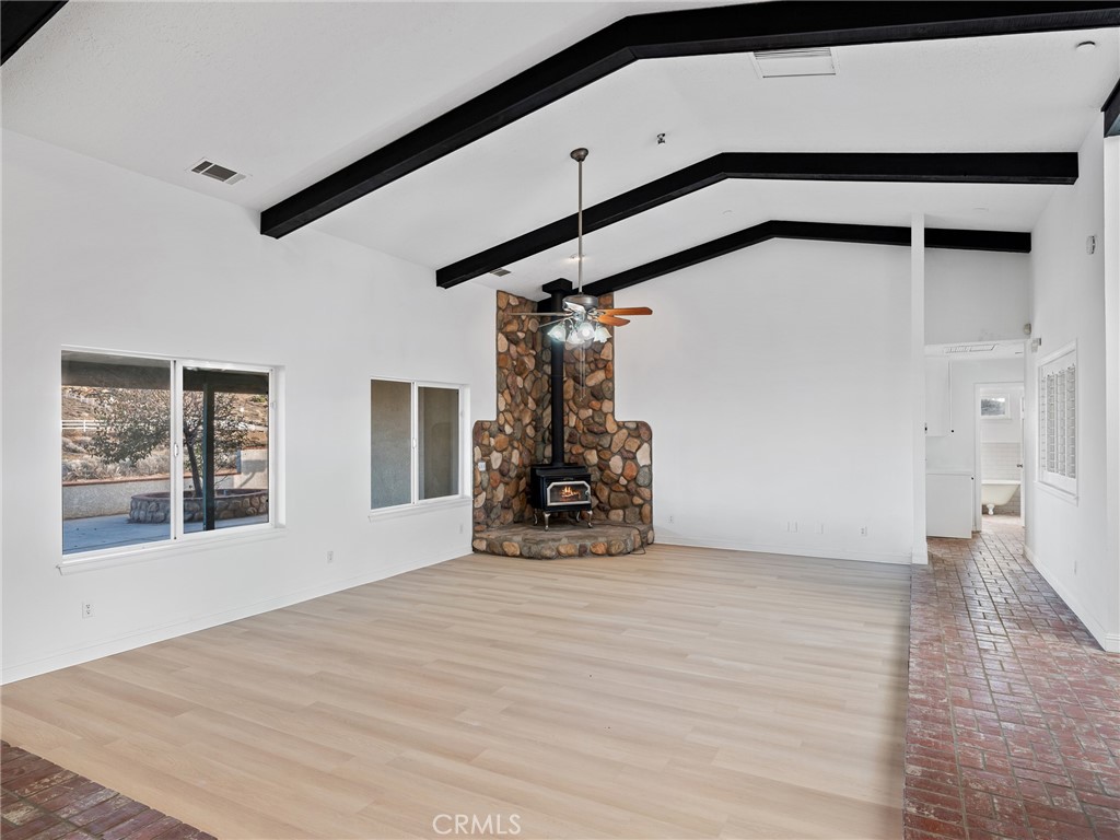 8135 Winmar Road Hesperia, CA 92344 - Photo 12 of 52 a view of empty room with wooden floor and fan