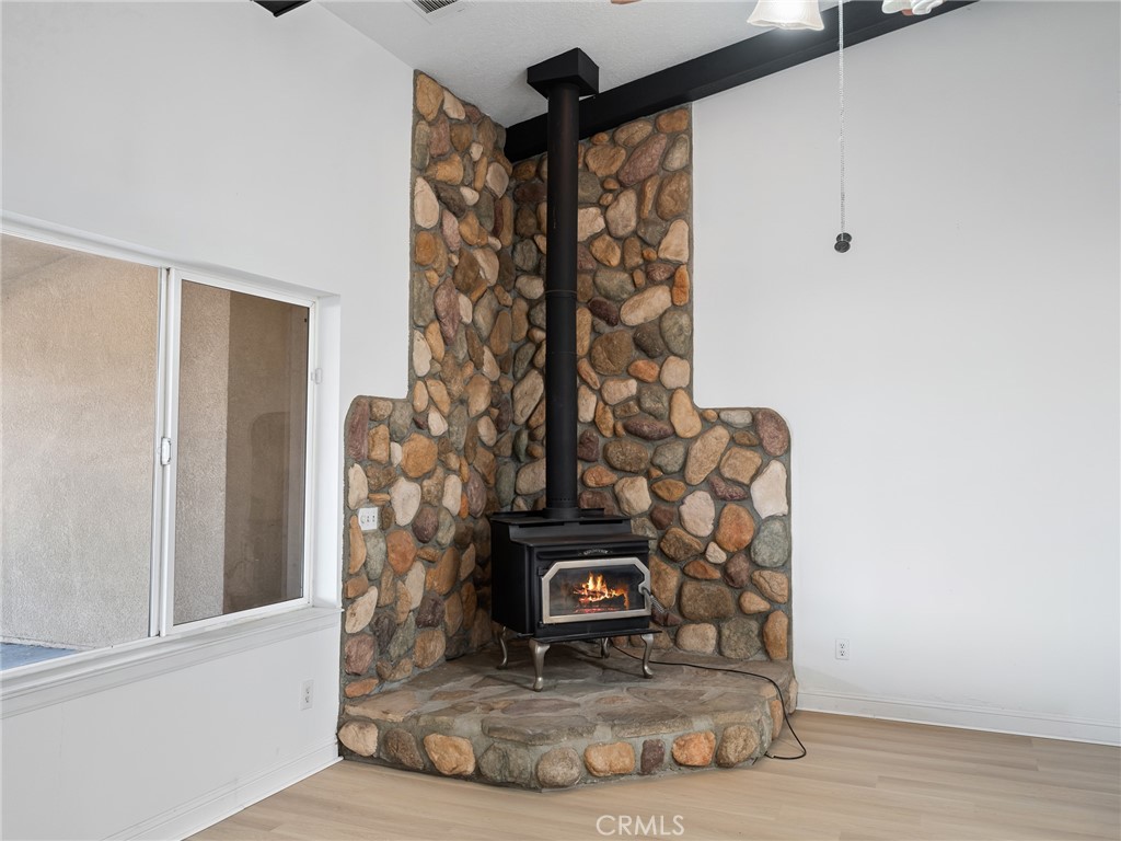 8135 Winmar Road Hesperia, CA 92344 - Photo 13 of 52 a view of a fireplace