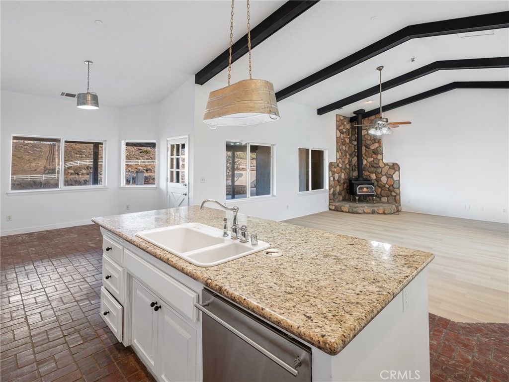 8135 Winmar Road Hesperia, CA 92344 - Photo 17 of 52 a bathroom with a granite countertop sink and a mirror