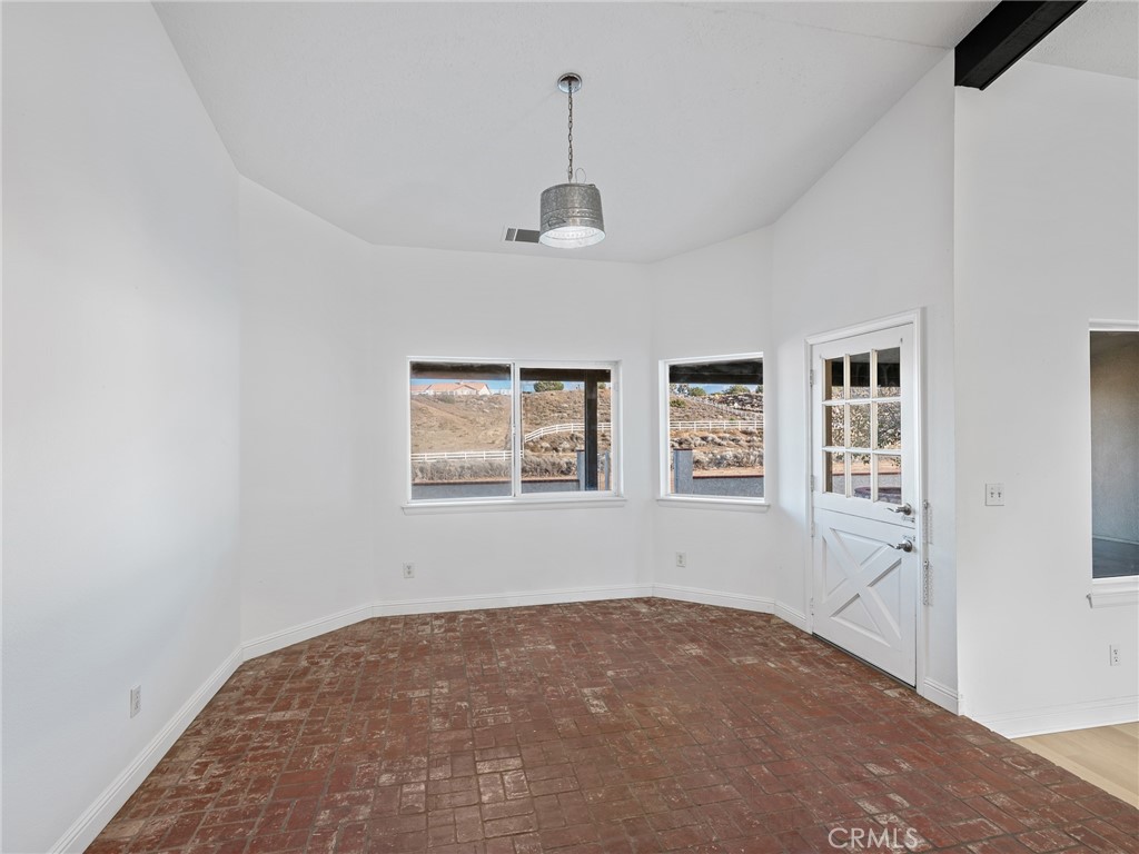 8135 Winmar Road Hesperia, CA 92344 - Photo 18 of 52 a view of empty room with windows