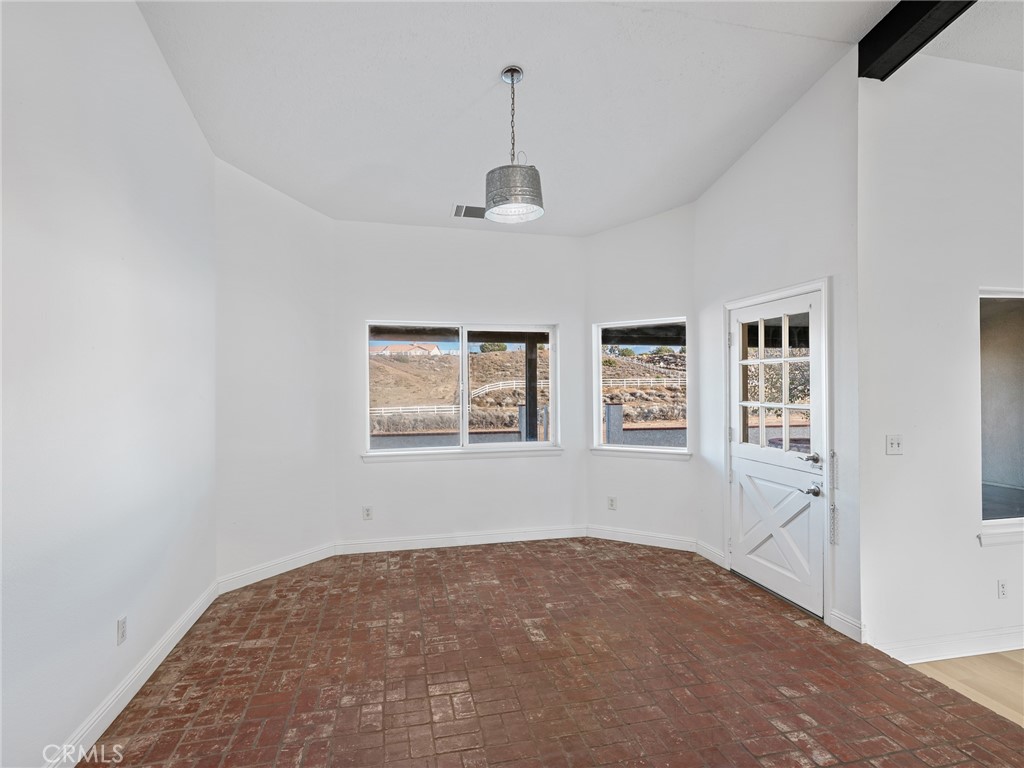 8135 Winmar Road Hesperia, CA 92344 - Photo 18 of 52 a view of empty room with windows
