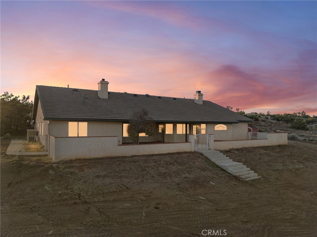 8135 Winmar Road Hesperia, CA 92344 - Photo 2 of 52 a front view of a house with a yard