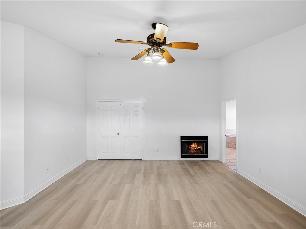 8135 Winmar Road Hesperia, CA 92344 - Photo 21 of 52 a view of a room with wooden floor and a window