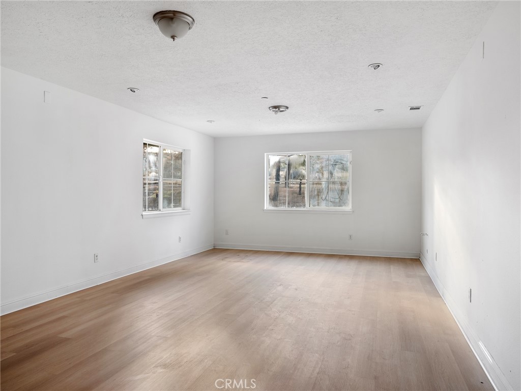 8135 Winmar Road Hesperia, CA 92344 - Photo 28 of 52 an empty room with windows