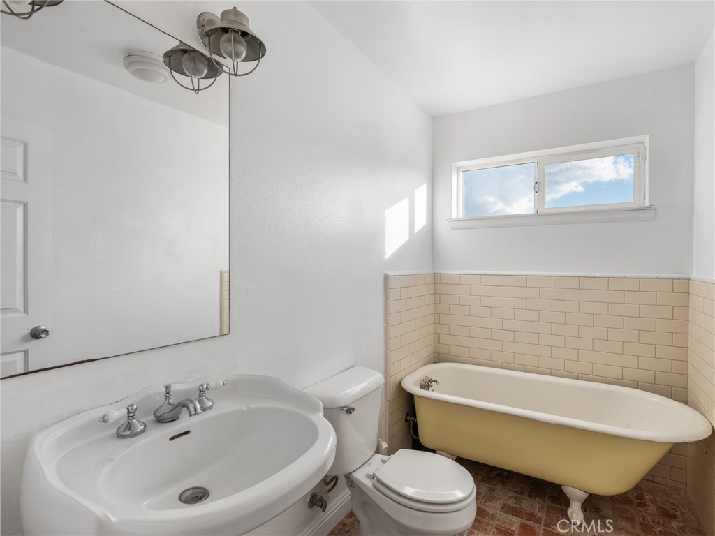 8135 Winmar Road Hesperia, CA 92344 - Photo 31 of 52 a bathroom with a sink toilet and shower