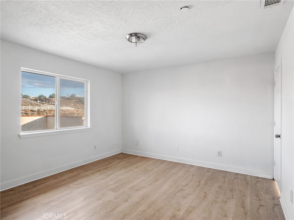 8135 Winmar Road Hesperia, CA 92344 - Photo 39 of 52 an empty room with a window