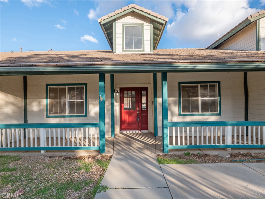 8135 Winmar Road Hesperia, CA 92344 - Photo 40 of 52 a front view of a house with a porch