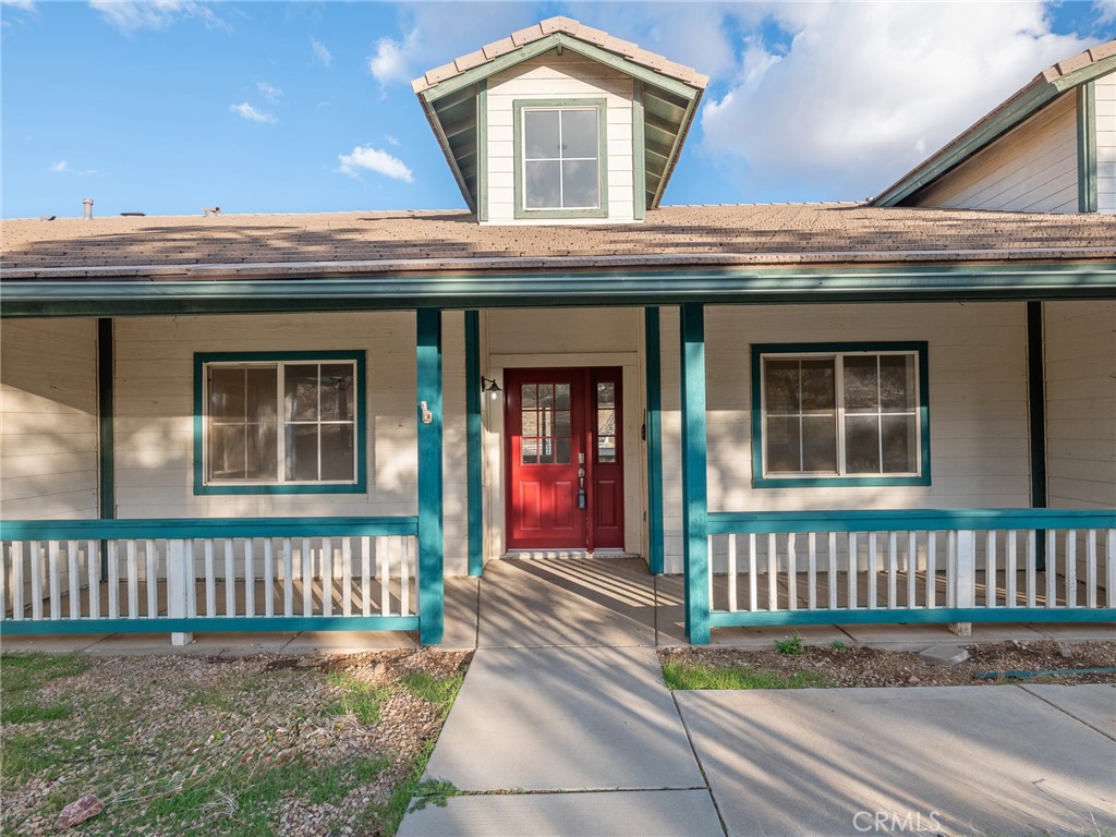 8135 Winmar Road Hesperia, CA 92344 - Photo 40 of 52 a front view of a house with a porch