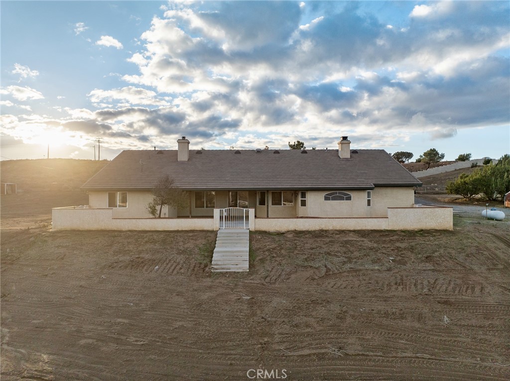 8135 Winmar Road Hesperia, CA 92344 - Photo 42 of 52 a view of a house with a yard