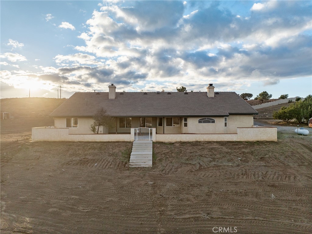 8135 Winmar Road Hesperia, CA 92344 - Photo 42 of 52 a view of a house with a yard
