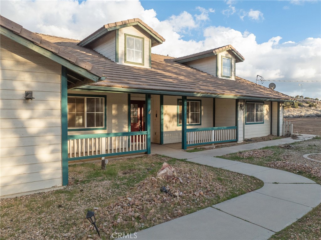 8135 Winmar Road Hesperia, CA 92344 - Photo 44 of 52 a front view of a house with a garden