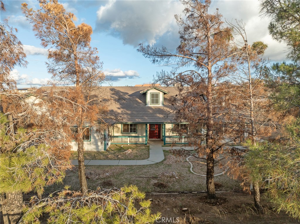 8135 Winmar Road Hesperia, CA 92344 - Photo 51 of 52 a front view of a house with a yard