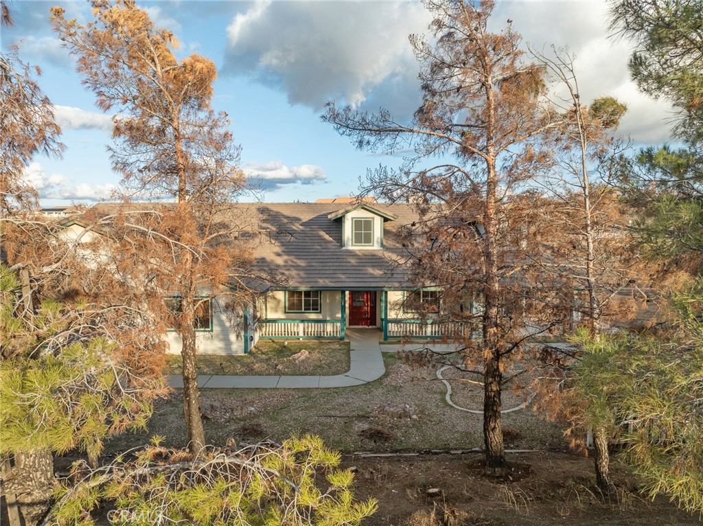 8135 Winmar Road Hesperia, CA 92344 - Photo 51 of 52 a front view of a house with a yard