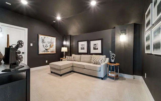 a living room with furniture a chandelier and a flat screen tv