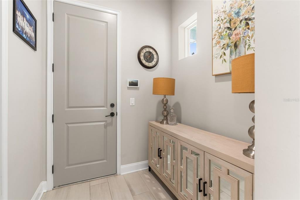 3474 Southwest 109 Drive Gainesville, FL 32608 - Photo 21 of 60 a view of an entryway with wooden floor