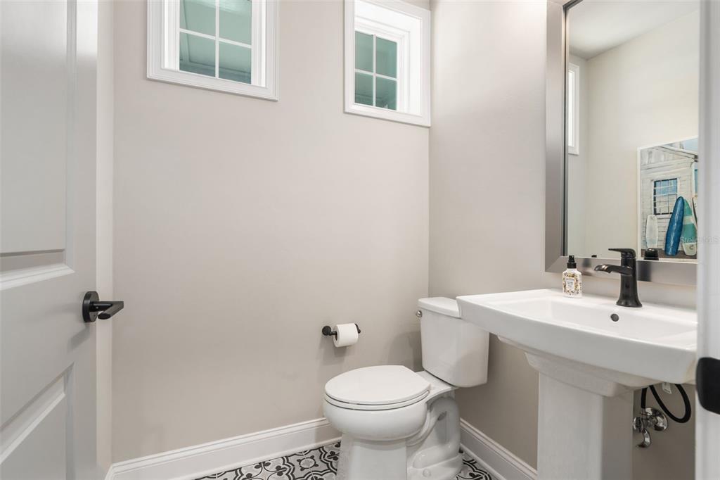 3474 Southwest 109 Drive Gainesville, FL 32608 - Photo 22 of 60 a bathroom with a sink toilet and a mirror