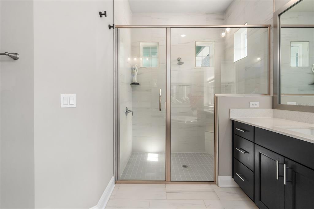 3474 Southwest 109 Drive Gainesville, FL 32608 - Photo 31 of 60 a bathroom with a shower and a sink