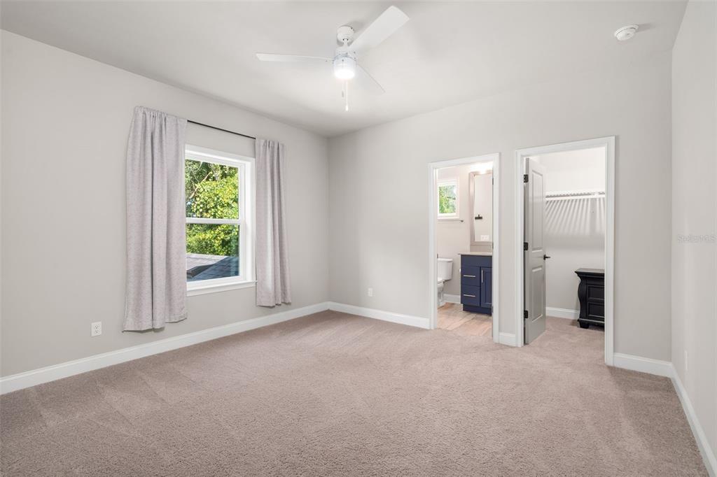 3474 Southwest 109 Drive Gainesville, FL 32608 - Photo 35 of 60 an empty room with windows and closet