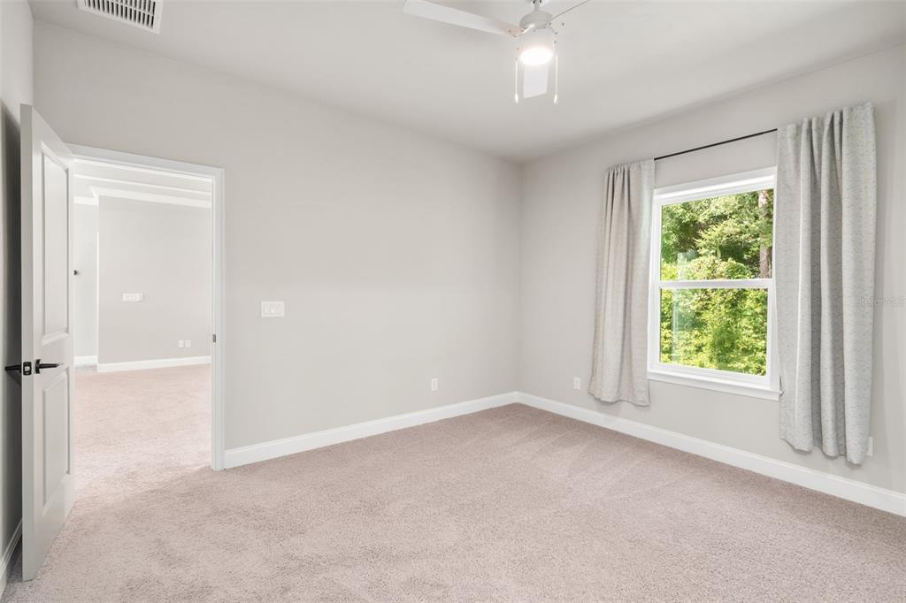 3474 Southwest 109 Drive Gainesville, FL 32608 - Photo 36 of 60 an empty room with a window