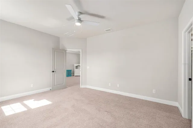 a view of a chairs and table in patio