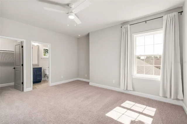 a view of a porch with furniture and garden