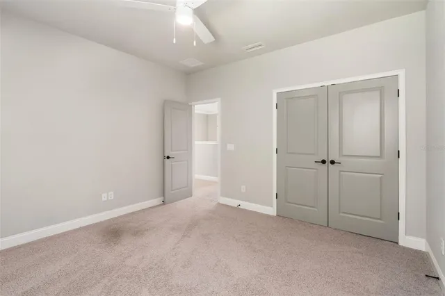 a view of a house with a garden and yard