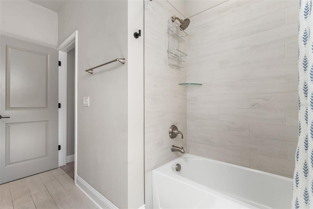 3474 Southwest 109 Drive Gainesville, FL 32608 - Photo 43 of 60 a bathroom with a bathtub