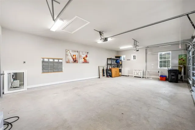 an aerial view of residential houses with outdoor space and city view