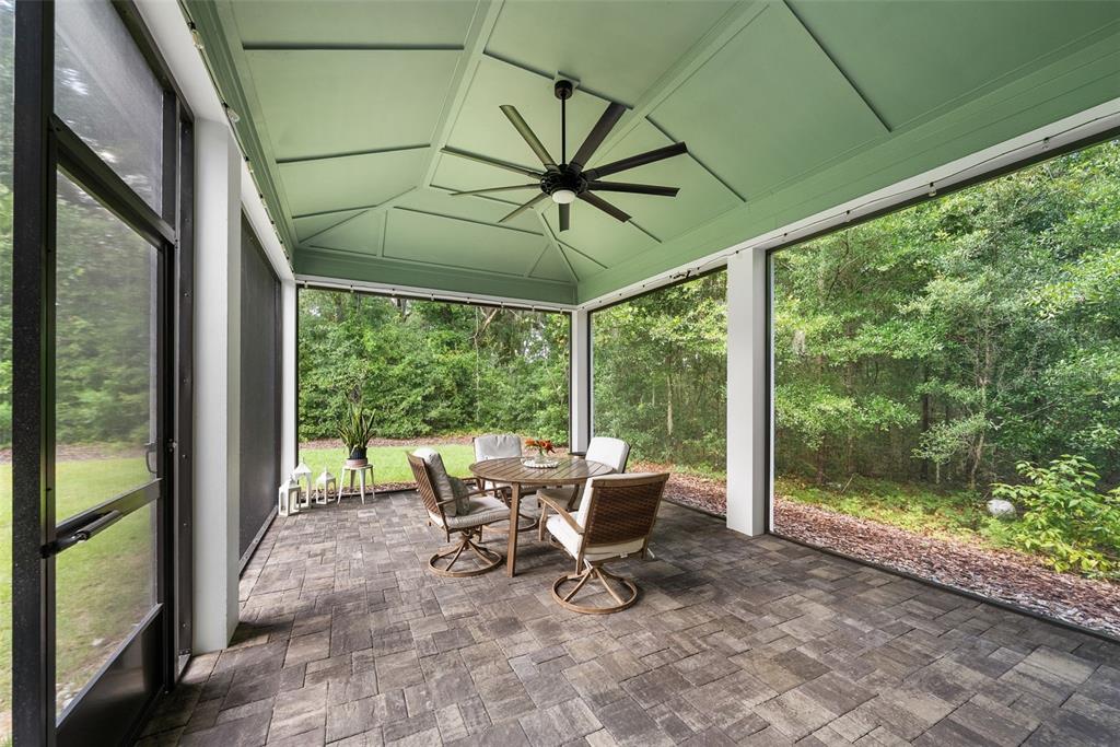 3474 Southwest 109 Drive Gainesville, FL 32608 - Photo 47 of 60 a view of a chairs and table in patio