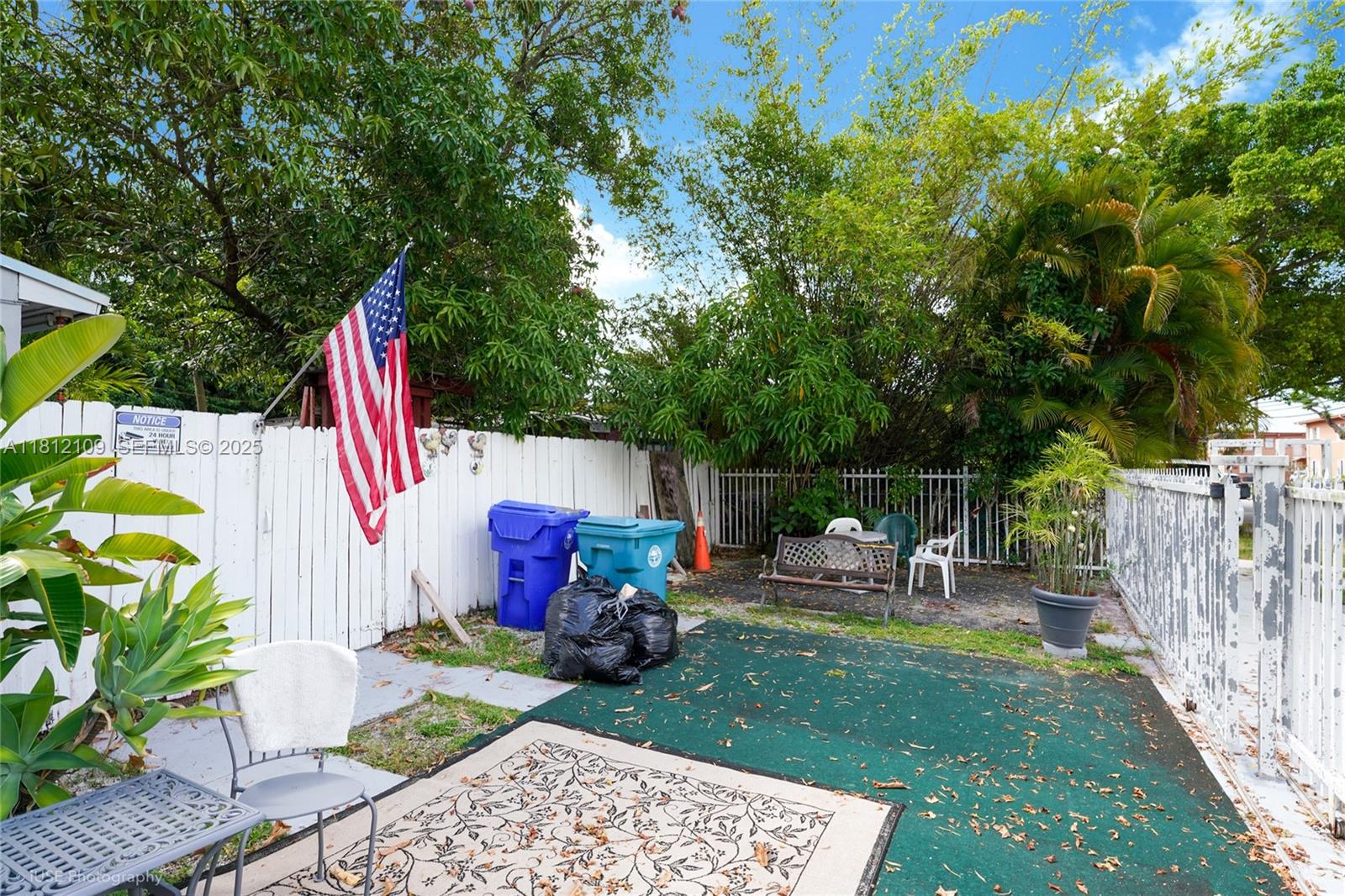 901 Southwest 34th Avenue Miami, FL 33135 - Photo 13 of 18 a view of backyard with seating space and trees