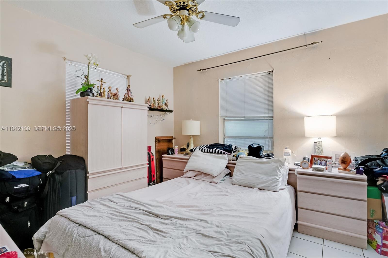 901 Southwest 34th Avenue Miami, FL 33135 - Photo 15 of 18 a bedroom with a bed and a window