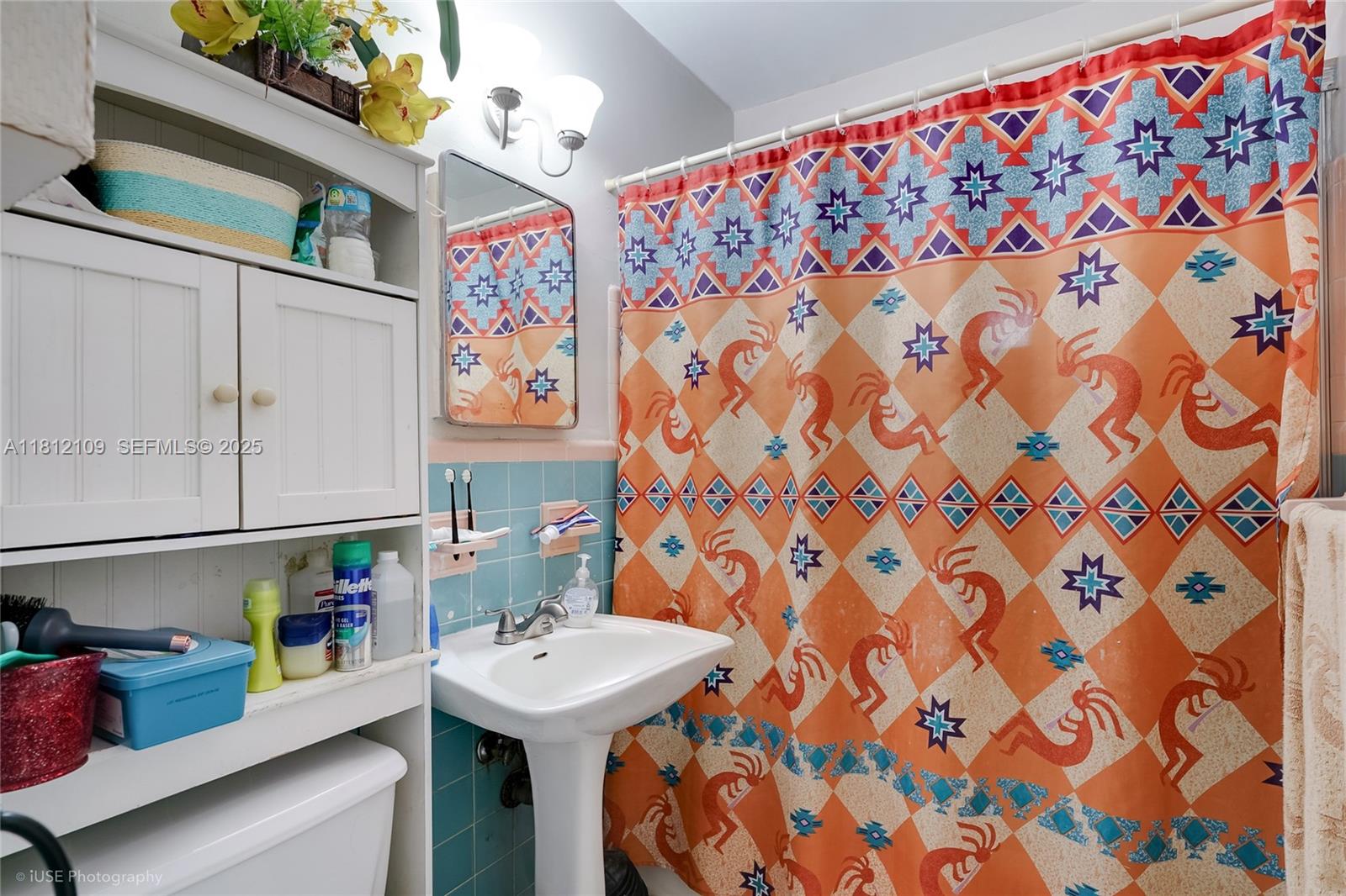 901 Southwest 34th Avenue Miami, FL 33135 - Photo 16 of 18 a bathroom with a sink and a mirror