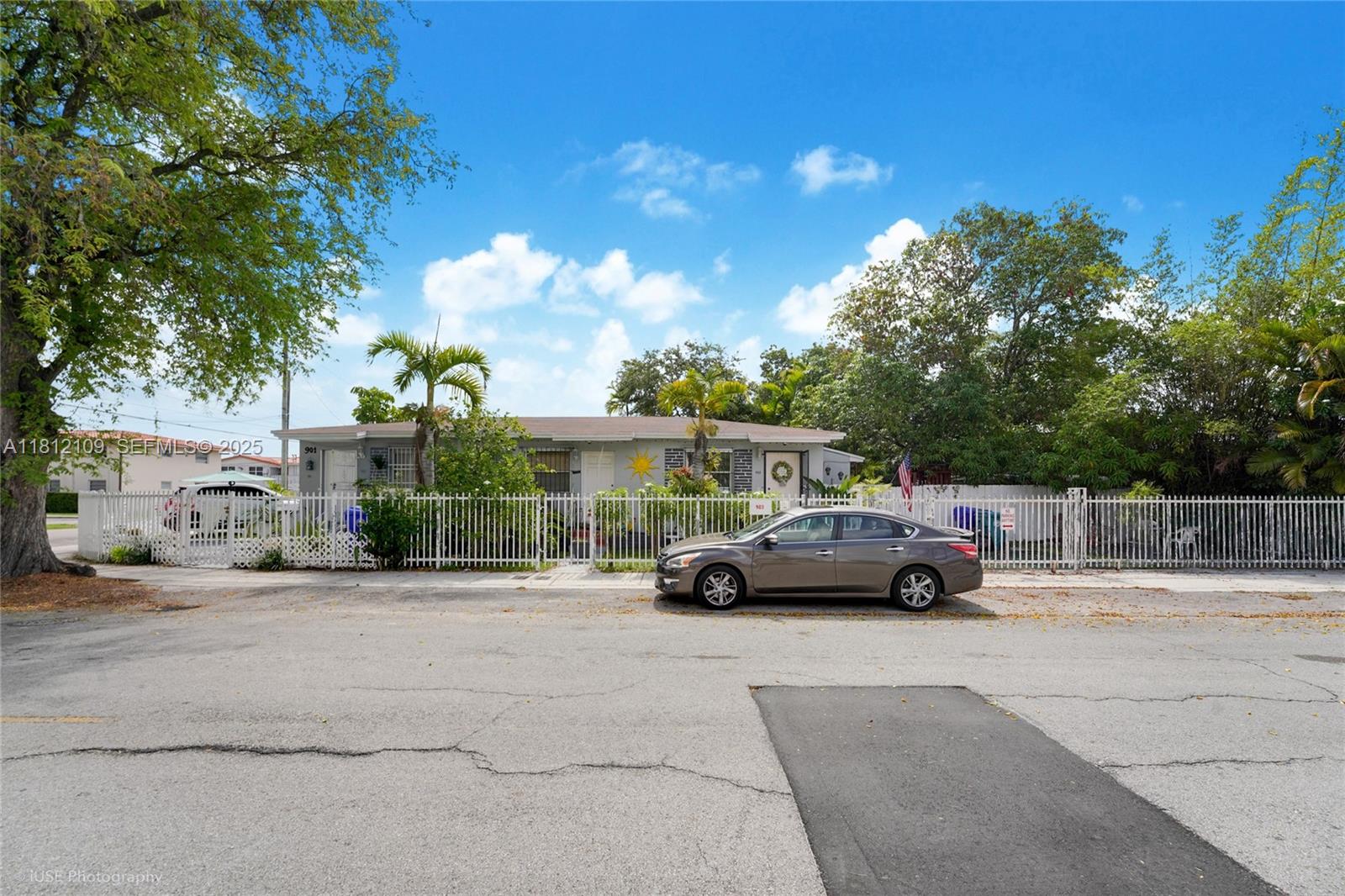 901 Southwest 34th Avenue Miami, FL 33135 - Photo 2 of 18 a view of street with parked cars