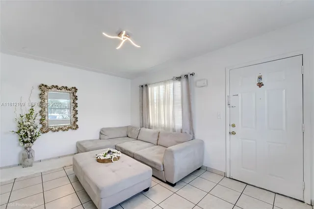a living room with furniture and a window
