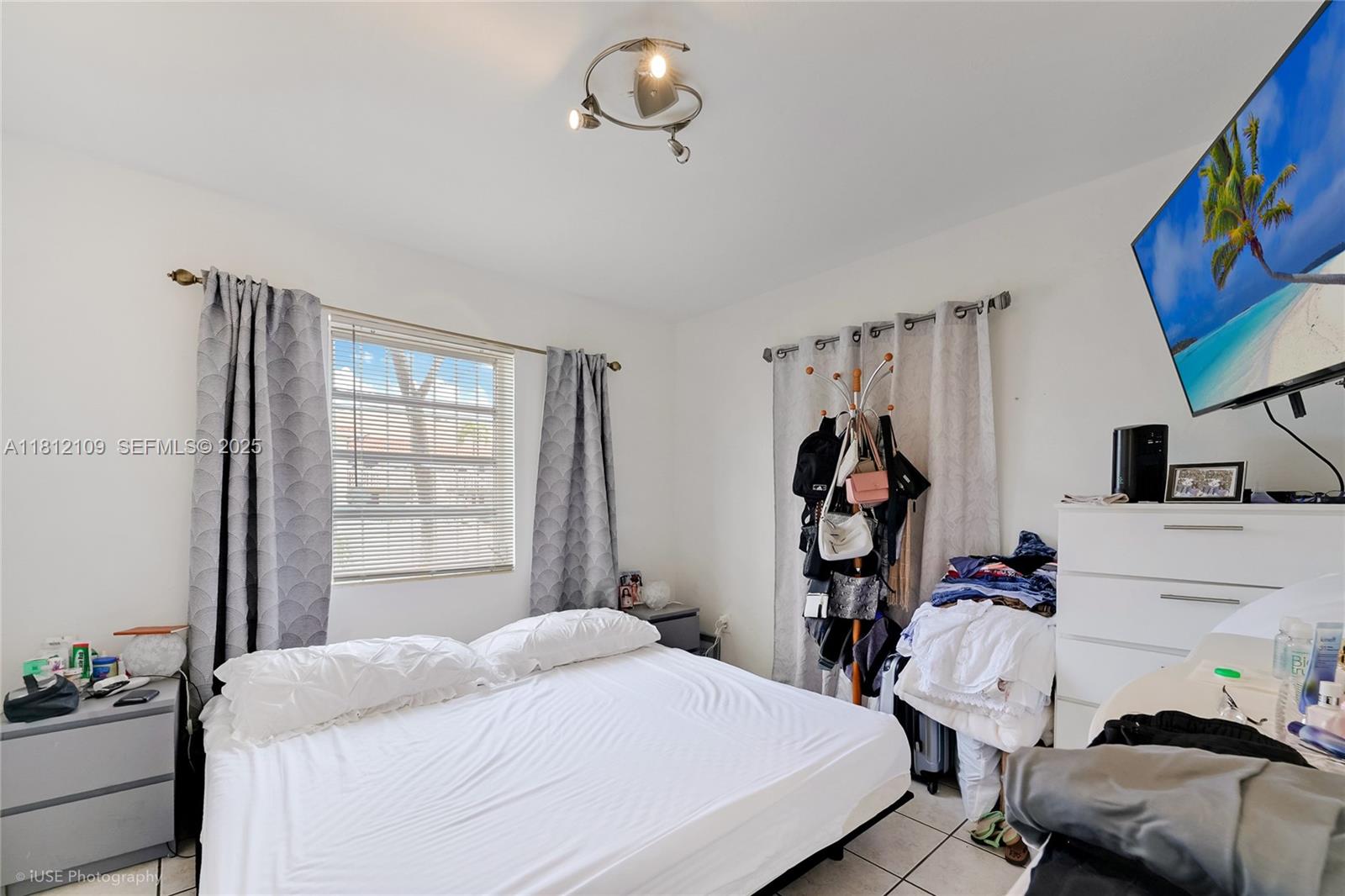 901 Southwest 34th Avenue Miami, FL 33135 - Photo 7 of 18 a bedroom with a bed and a window