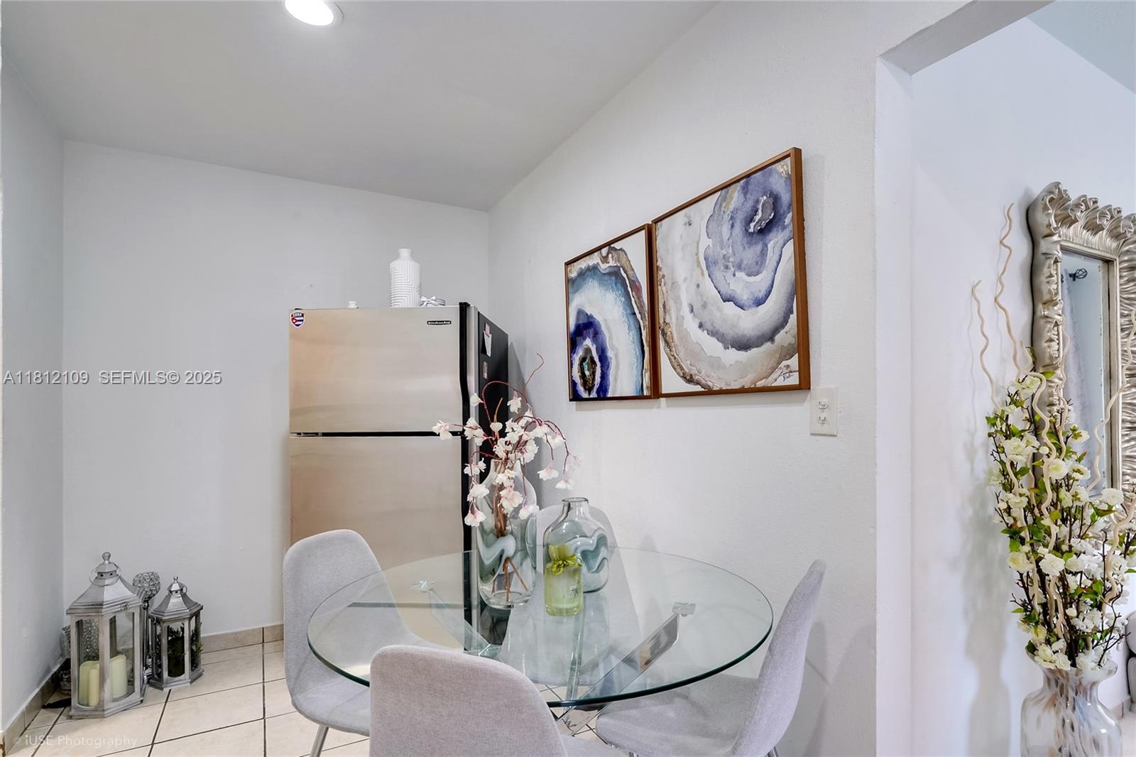 901 Southwest 34th Avenue Miami, FL 33135 - Photo 9 of 18 a dining room with furniture and wooden floor