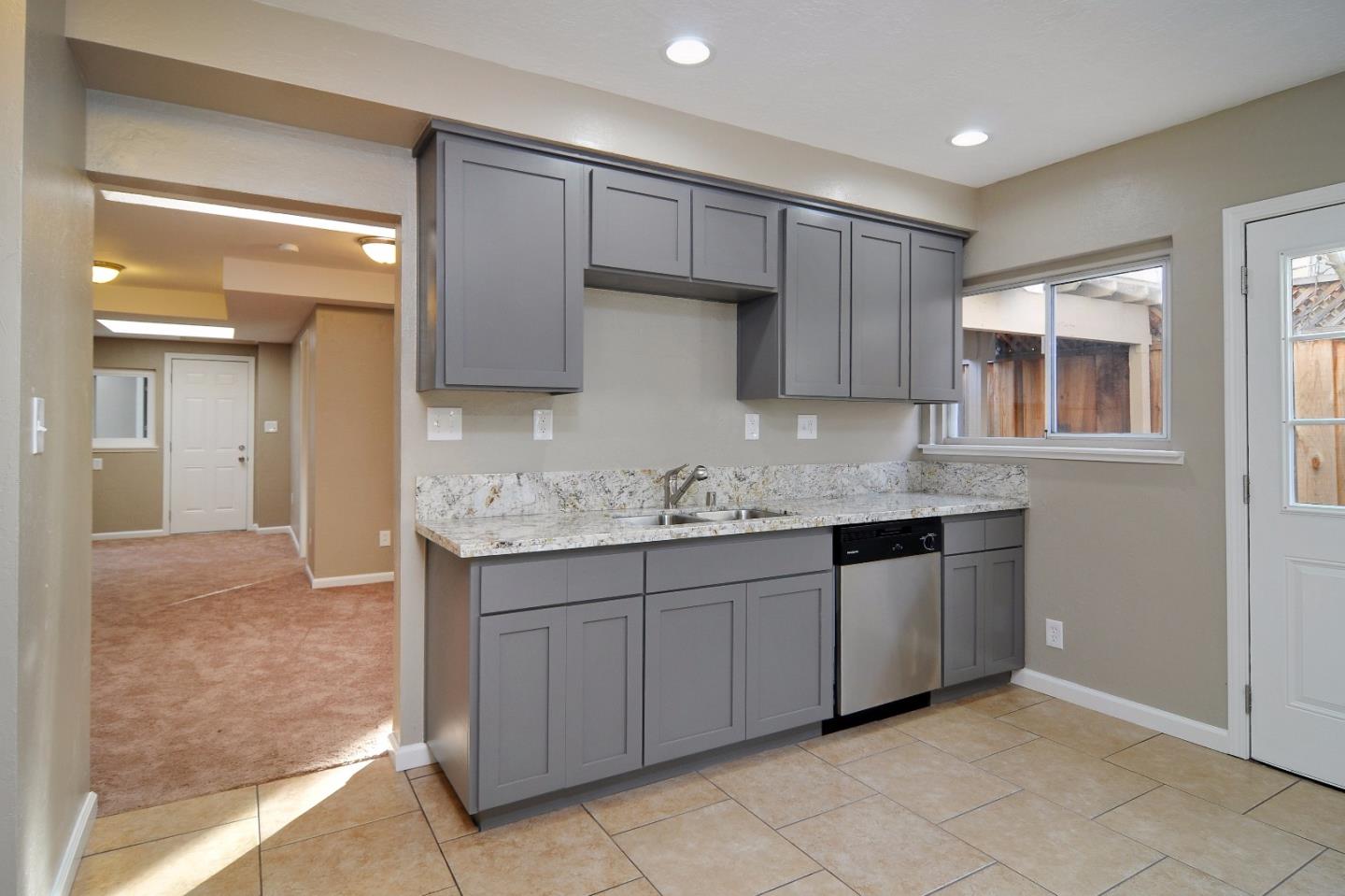 2994 Rustic Drive San Jose, CA 95124 - Photo 14 of 22 a kitchen with granite countertop a sink and cabinets