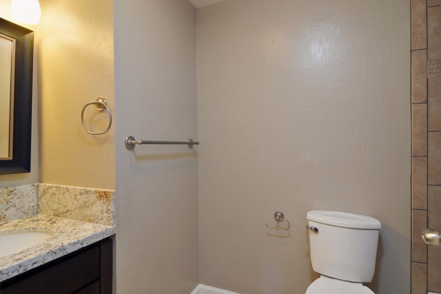 2994 Rustic Drive San Jose, CA 95124 - Photo 15 of 22 a bathroom with a granite countertop sink and a toilet