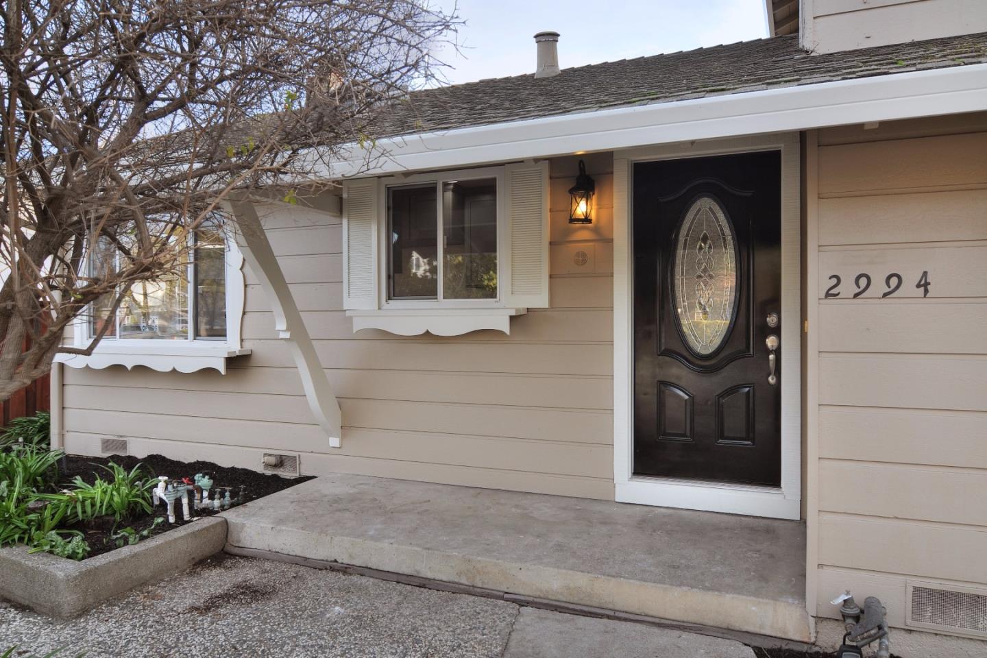 2994 Rustic Drive San Jose, CA 95124 - Photo 2 of 22 a front view of a house with a garden