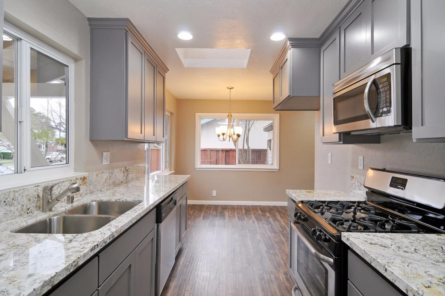 2994 Rustic Drive San Jose, CA 95124 - Photo 3 of 22 a kitchen with stainless steel appliances granite countertop a sink stove and cabinets