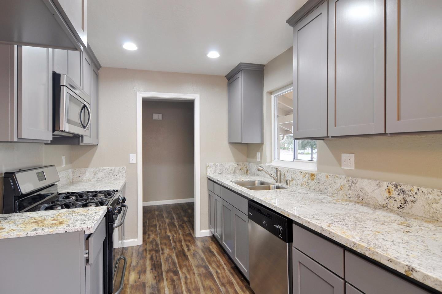 2994 Rustic Drive San Jose, CA 95124 - Photo 5 of 22 a kitchen with stainless steel appliances granite countertop a sink stove and refrigerator