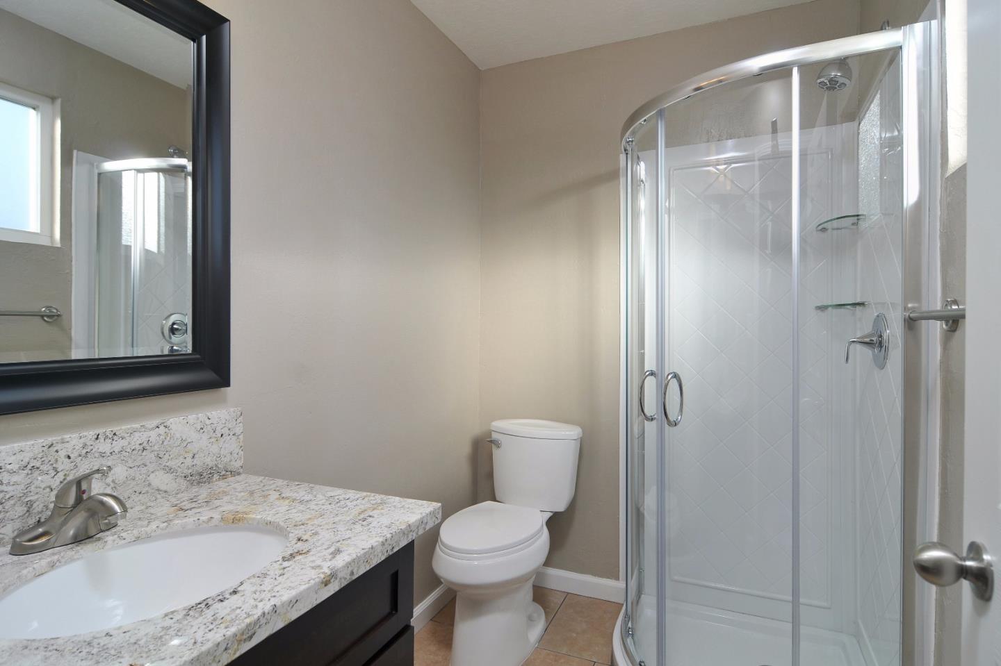 2994 Rustic Drive San Jose, CA 95124 - Photo 8 of 22 a bathroom with a granite countertop sink toilet and shower